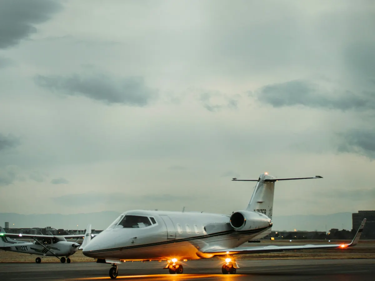 Small business jet parked in moody evening light